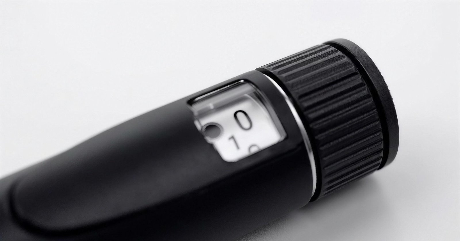 Close-up of the AminoPen Pro dial, ring, and grip